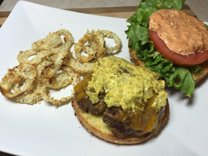 California-Style Griddled Cheeseburgers with Secret Sauce and Crispy Baked Onion Rings.