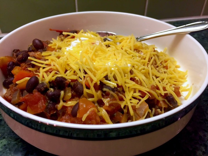 Southwestern Black Bean Chili with Cheddar, Sour Cream, and Scallions.