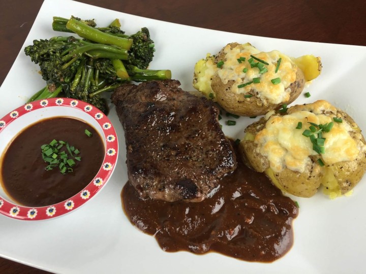 Steak with Crash Potatoes With Homemade Steak Sauce and Broccolini.
