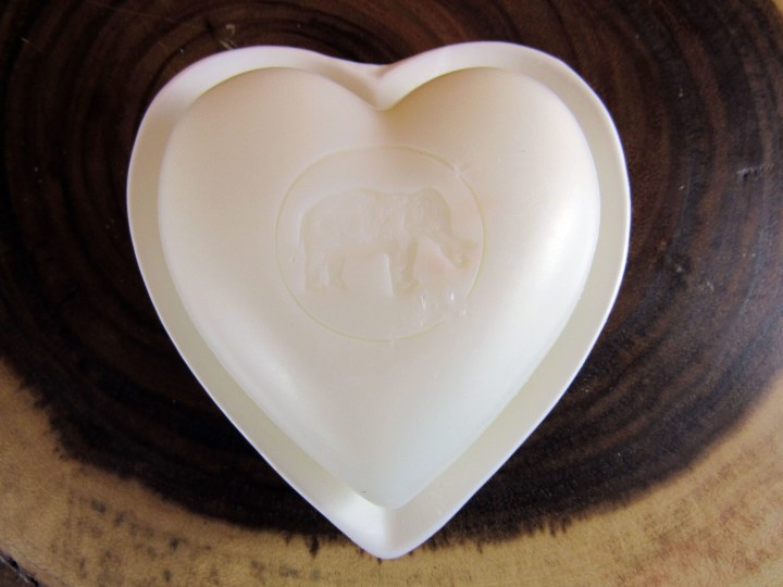 Heart soap nestled on a heart soap dish.