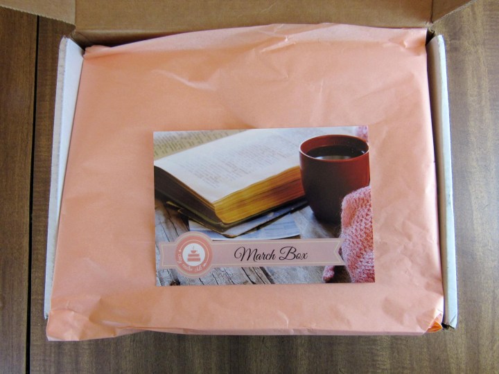 What is hiding under the tissue paper?