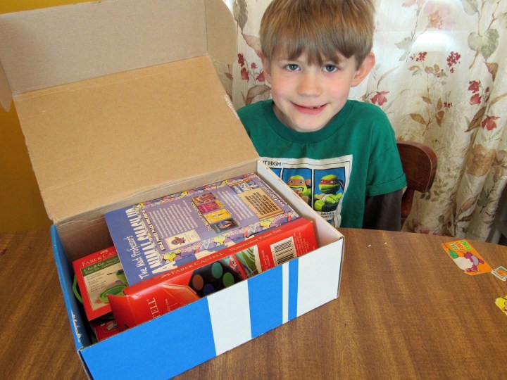 J showing off Kids Prize Pack