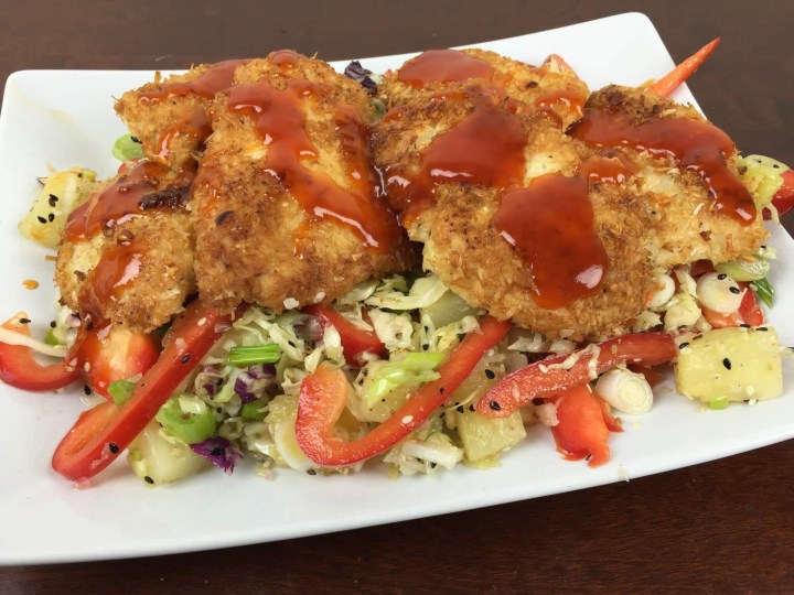 Coconut Crusted Chicken With Pineapple Slaw And Sweet And Sour Drizzle.